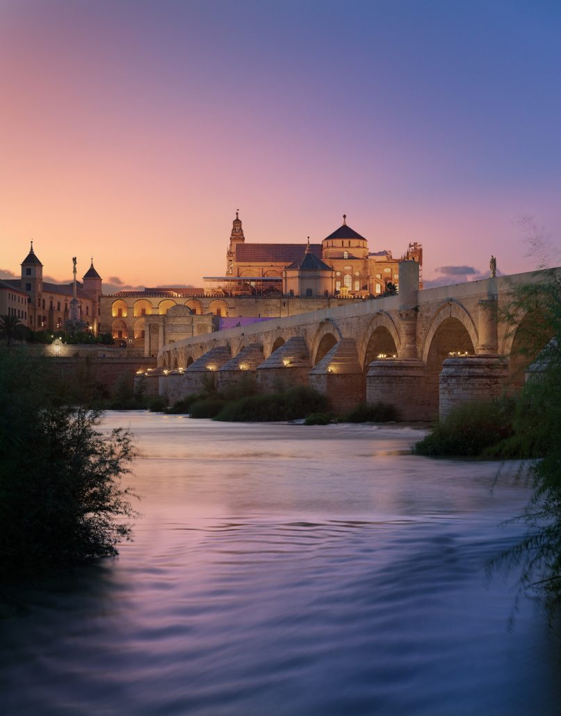 Mosque and Roman Bridge at sunset. Córdoba