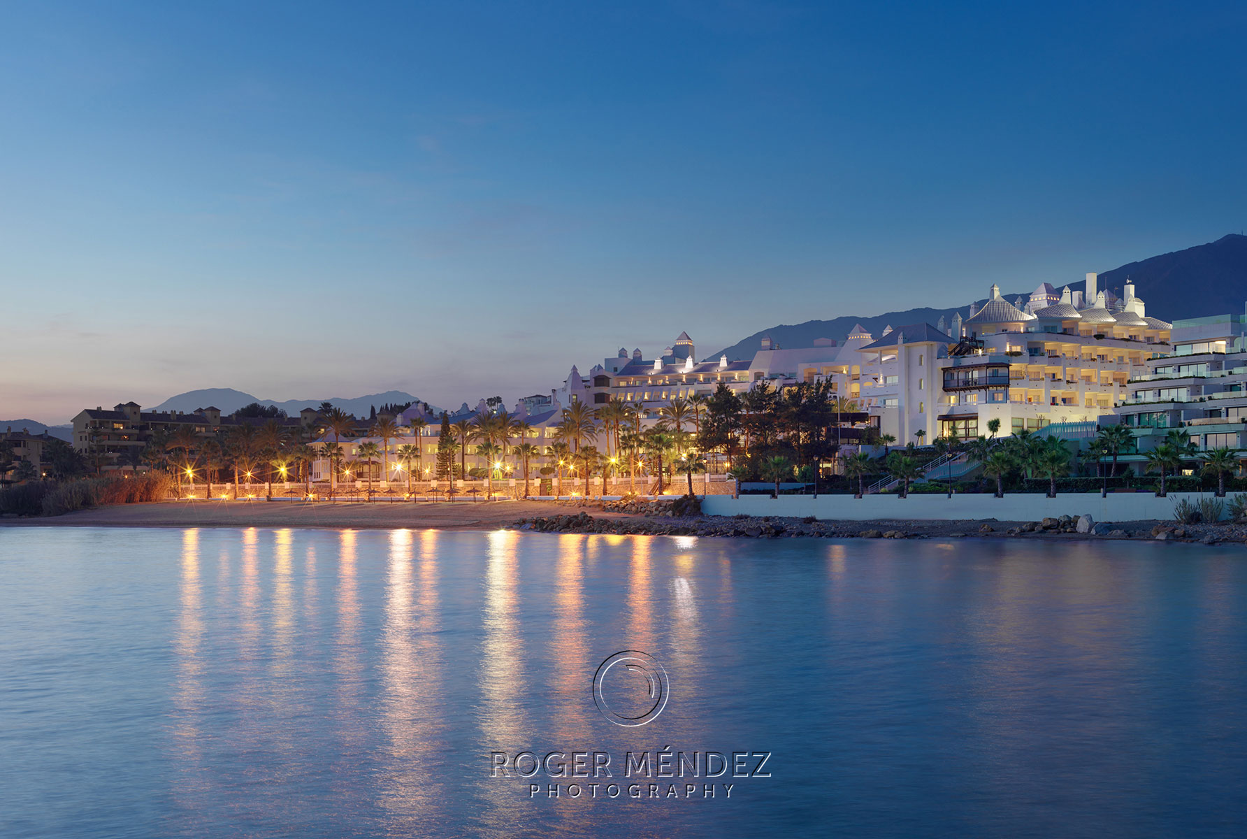 Hotel view from the see at night of H10 Estepona Palace
