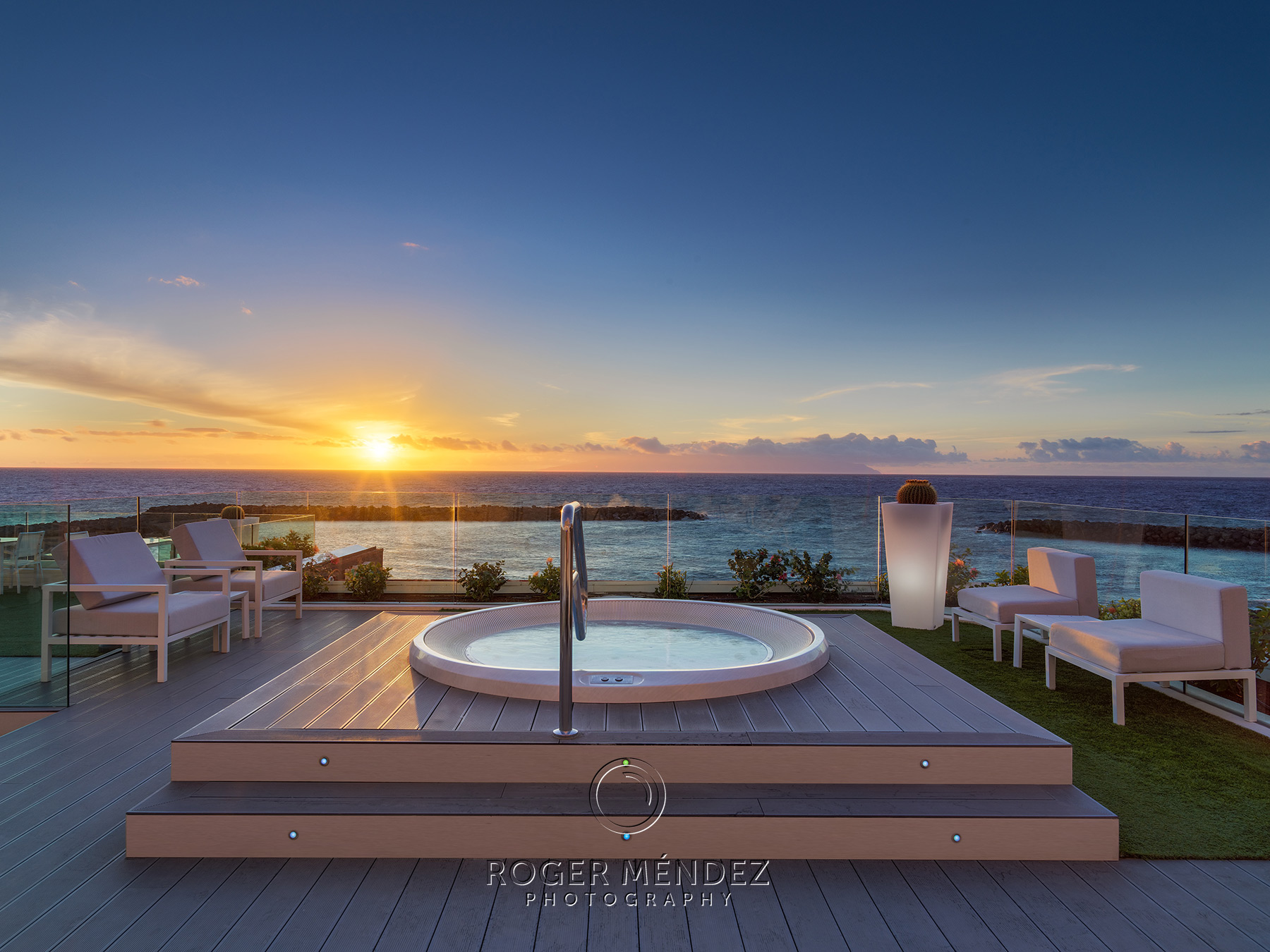 Sunset Beach terrace with jacuzzi at sunset