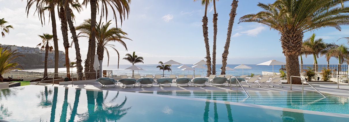 Photographs of the room and pool for Paradisus Gran Canaria hotel